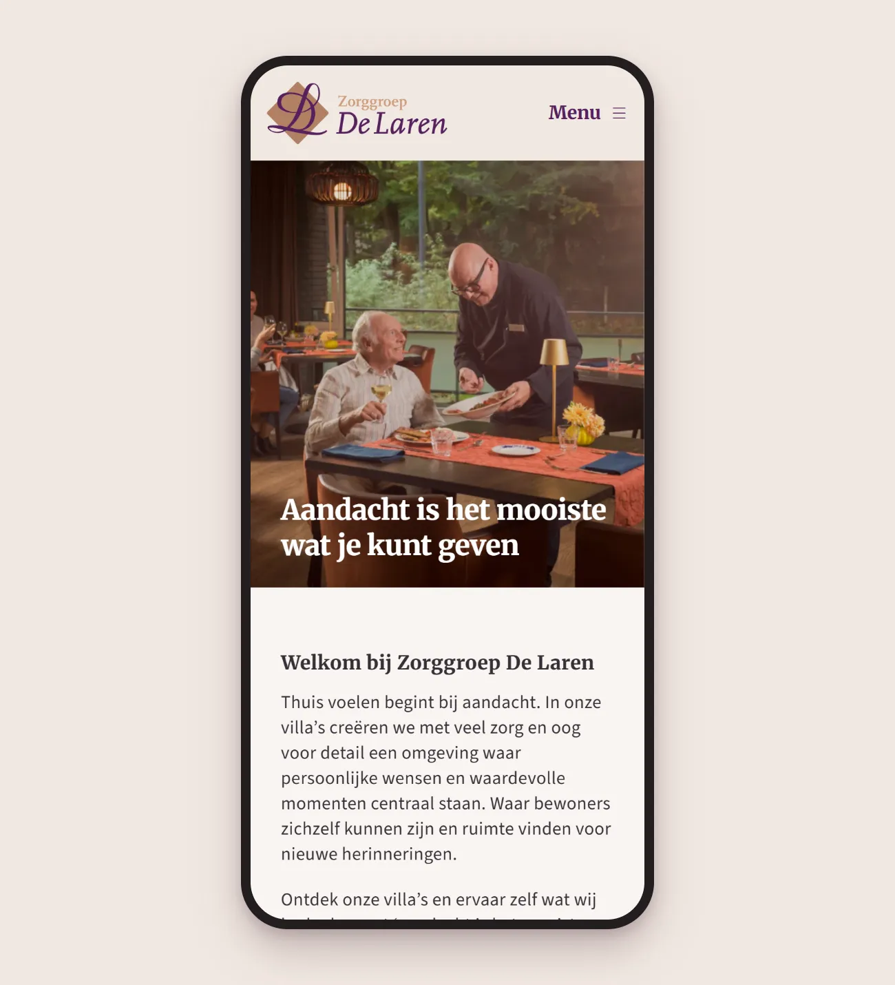 Smartphone showing the Zorggroep De Laren home page: the logo, the menu button, the heading ‘Aandacht is het mooiste wat je kunt geven’ and the welcome text